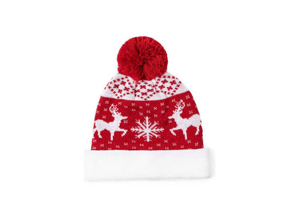 Gorro original con motivos navideños y pom pom a juego