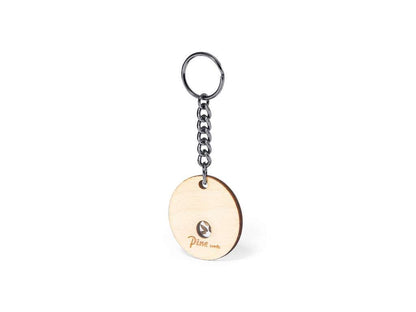 Llavero de madera de haya con semillas de pino - regalo sostenible